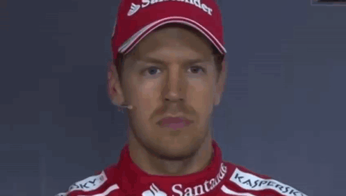 A Group Of Racing Drivers Are Standing In Front Of A Sign That Says " Don T Believe That " GIF