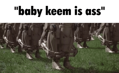 A Group Of Robots Are Walking In A Field With The Words " Baby Keem Is Ass " On The Bottom . GIF
