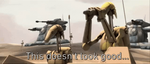 A Group Of Robots Standing Next To Each Other With The Words " This Does N't Look Good " Above Them GIF