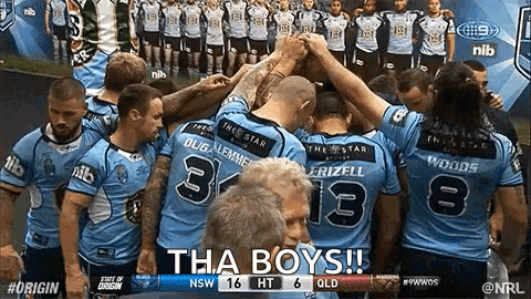 A Group Of Rugby Players Are Huddled Together In A Huddle With The Words Tha Boys Written On The Bottom GIF