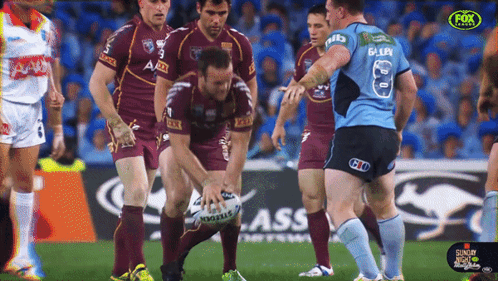 A Group Of Rugby Players On A Field With One Wearing The Number 8 Jersey GIF