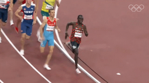 A Group Of Runners Are Running On A Track And One Of Them Is Wearing A Kenya Shirt GIF