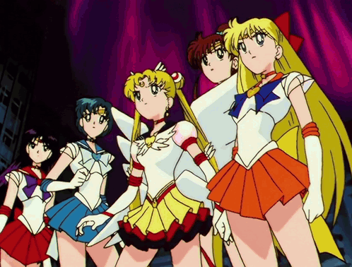 A Group Of Sailor Moon Characters Are Standing Together GIF