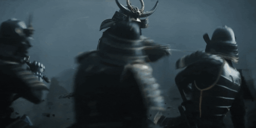 A Group Of Samurai In Armor Are Standing In The Dark GIF