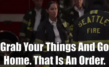 A Group Of Seattle Firefighters Standing In Front Of A Fire Truck GIF
