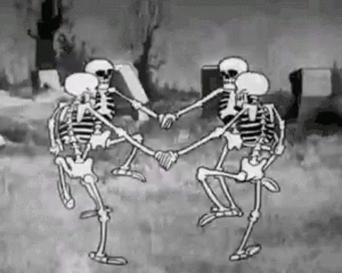 A Group Of Skeletons Are Dancing In A Circle In A Cemetery In A Black And White Cartoon . GIF