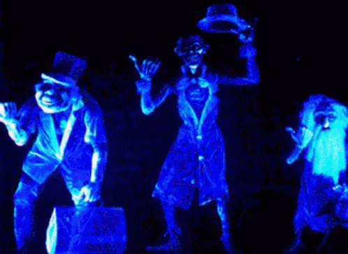 A Group Of Skeletons Are Glowing In Blue Light GIF