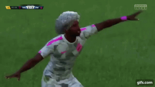 A Group Of Soccer Players Are Celebrating A Goal In Front Of A Fifa Sign GIF