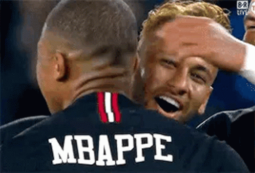 A Group Of Soccer Players Are Hugging Each Other And One Of Them Is Wearing A Jersey With The Name Mbappe On It . GIF