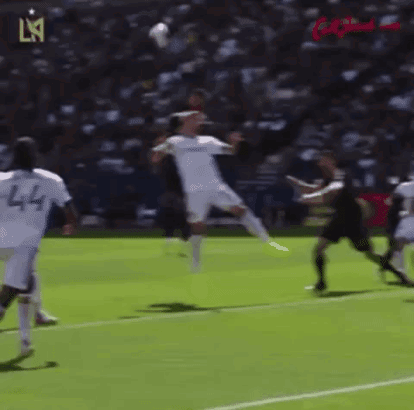 A Group Of Soccer Players Are Playing A Game Of Soccer On A Field GIF