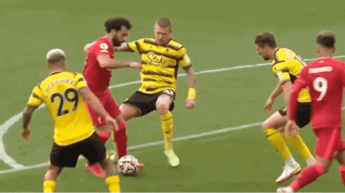 A Group Of Soccer Players Are Playing A Game Of Soccer On A Soccer Field . GIF