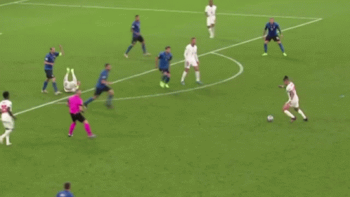 A Group Of Soccer Players Are Playing A Game Of Soccer On A Soccer Field . GIF