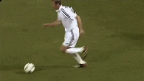 A Group Of Soccer Players Are Playing A Game On A Field And One Of Them Is Wearing A Number 5 Jersey . GIF