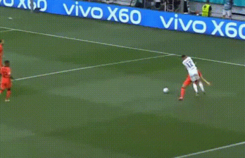 A Group Of Soccer Players Are Playing A Game On A Field With A Vivo X60 Banner In The Background . GIF