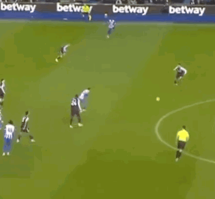 A Group Of Soccer Players Are Playing A Game On A Field With Betting Advertisements In The Background . GIF