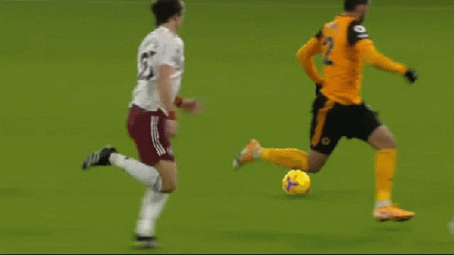 A Group Of Soccer Players Are Playing A Game On A Green Field GIF