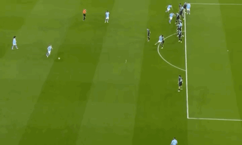 A Group Of Soccer Players Are Playing A Game On A Green Field GIF