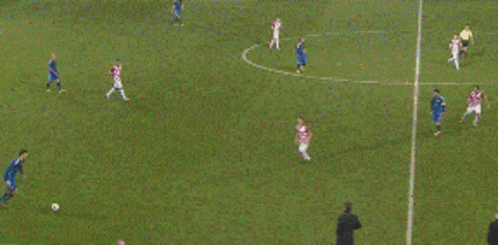 A Group Of Soccer Players Are Playing A Game On A Soccer Field GIF