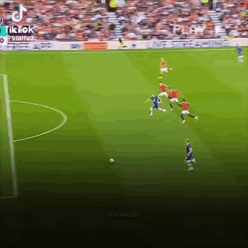 A Group Of Soccer Players Are Playing A Game On A Soccer Field . GIF