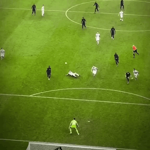 A Group Of Soccer Players Are Playing On A Field And One Of Them Is Wearing A White Jersey With The Number 10 GIF