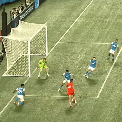 A Group Of Soccer Players Are Playing On A Field That Has A Sign That Says Shop Now GIF