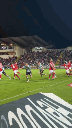 A Group Of Soccer Players Are Playing On A Field With A Banner In The Foreground That Says ' Allianz ' GIF