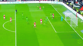 a group of soccer players are playing on a field with a sign that says ' allianz ' on it