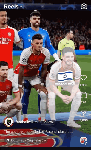 a group of soccer players are posing for a picture on a screen