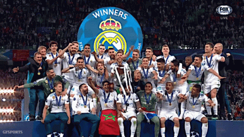 a group of soccer players are posing for a picture with a trophy that says winners on it
