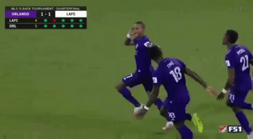 A Group Of Soccer Players Are Running On A Field With The Number 18 On Their Jersey GIF