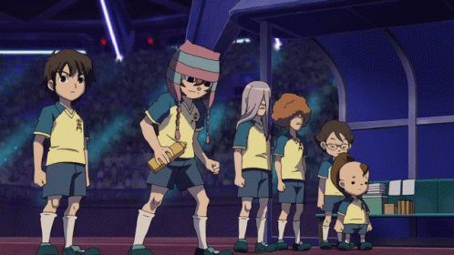 A Group Of Soccer Players Are Standing In A Line With One Wearing A Shirt That Says ' Samurai ' GIF