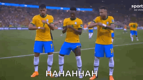 A Group Of Soccer Players Are Standing On A Field . GIF
