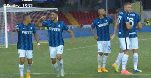 a group of soccer players are standing on a field wearing jerseys that say irelli
