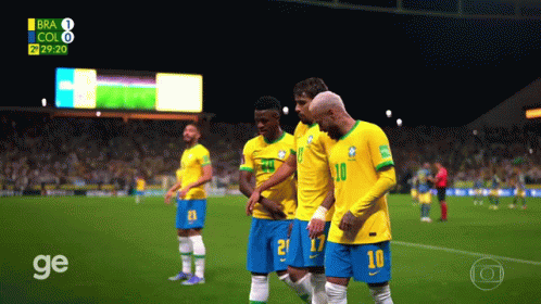 a group of soccer players are standing on a field with the number 10 on their jersey