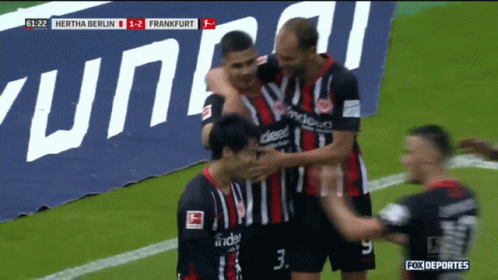 A Group Of Soccer Players Celebrate A Goal Against Frankfurt GIF