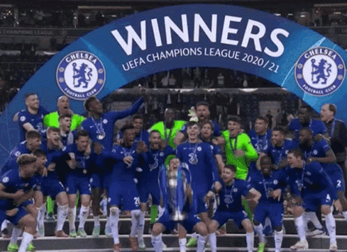 A Group Of Soccer Players Celebrate With A Banner That Says Winners GIF