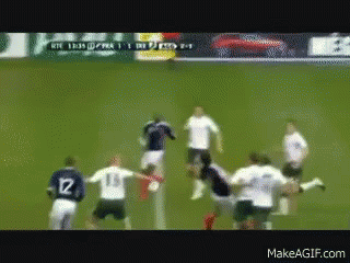 A Group Of Soccer Players On A Field With One Wearing Number 12 GIF