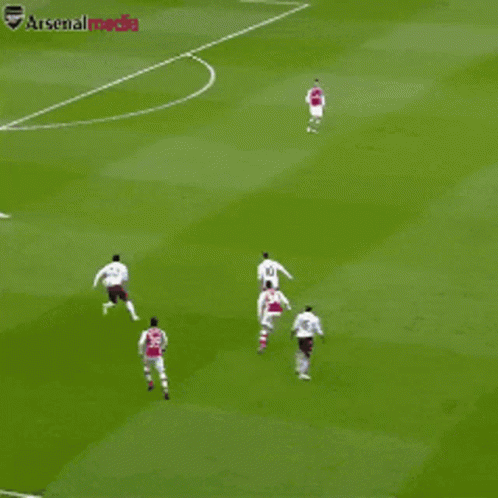 A Group Of Soccer Players On A Field With The Word Arsenal Visible GIF
