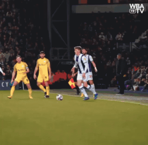 A Group Of Soccer Players On A Field With The Word Wba On The Bottom Left GIF