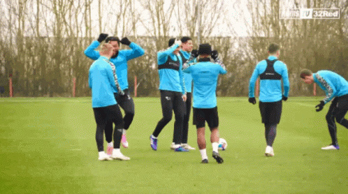 A Group Of Soccer Players On A Field With The Words 32Red On The Bottom Left GIF
