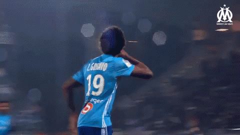 A Group Of Soccer Players Wearing Blue Jerseys With The Number 19 On Them GIF