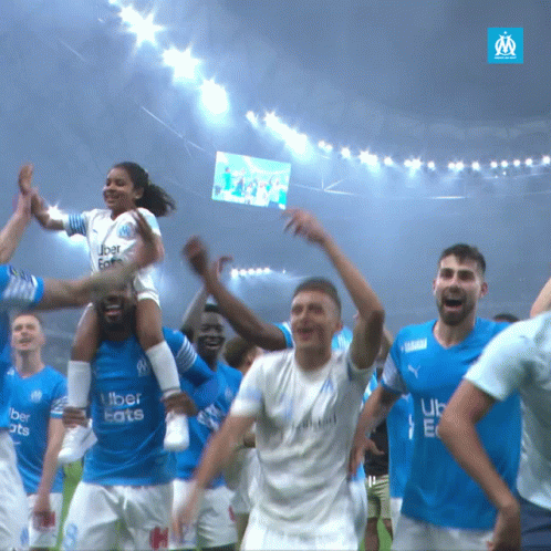 A Group Of Soccer Players Wearing Blue Uber Eats Jerseys GIF