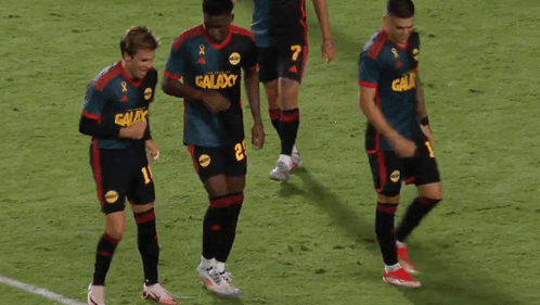 A Group Of Soccer Players Wearing Galaxy Uniforms GIF