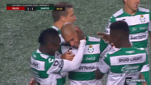 A Group Of Soccer Players Wearing Green And White Jerseys Sponsored By Bud Light GIF