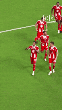 A Group Of Soccer Players Wearing Red Jerseys With The Number 17 On The Front GIF