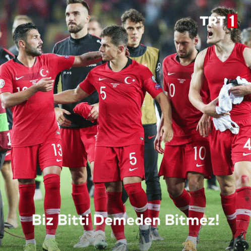 A Group Of Soccer Players Wearing Red Jerseys With Trt 1 Written On The Bottom GIF
