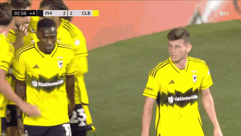 A Group Of Soccer Players Wearing Yellow Jerseys That Say Nationalwide On Them GIF