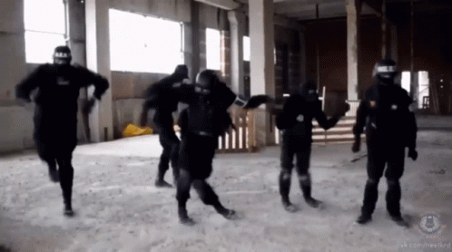 A Group Of Soldiers Are Holding Hands In A Room With A Watermark That Says ' Sns ' GIF