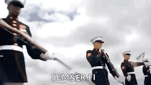 A Group Of Soldiers Are Marching In A Line With Their Guns In A Parade . GIF
