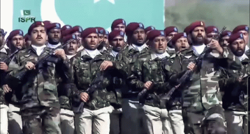 A Group Of Soldiers Are Marching In Front Of A Flag That Says ' Ispr ' On It GIF
